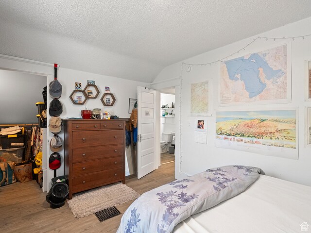 509 E 800 S, Salt Lake City, UT 84102 - bedroom featuring wood finished floors and a textured ceiling