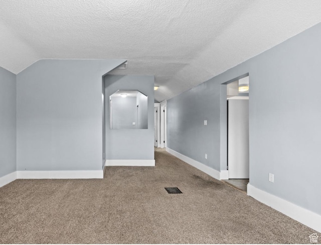 509 E 800 S, Salt Lake City, UT 84102 - spare room with vaulted ceiling, carpet flooring, and a textured ceiling