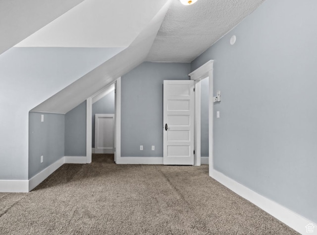 509 E 800 S, Salt Lake City, UT 84102 - bonus room featuring carpet floors, vaulted ceiling, and a textured ceiling