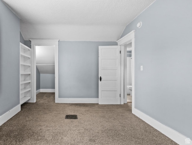 509 E 800 S, Salt Lake City, UT 84102 - unfurnished bedroom featuring lofted ceiling, a textured ceiling, and carpet