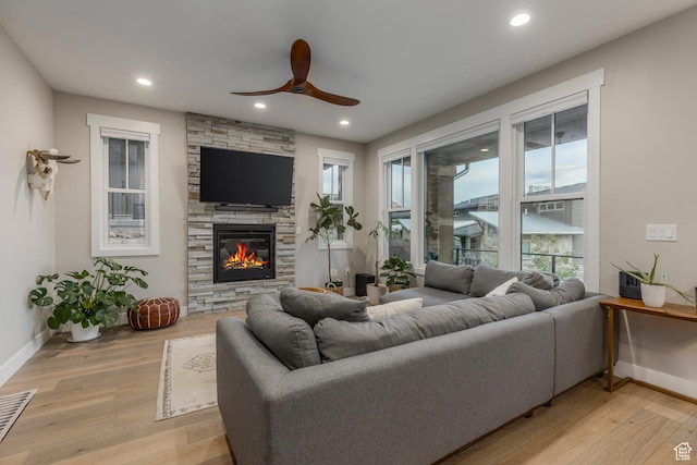 11721 N Shoreline Dr, Hideout, UT 84036 - living room featuring ceiling fan, a stone fireplace, light wood finished floors, and recessed lighting