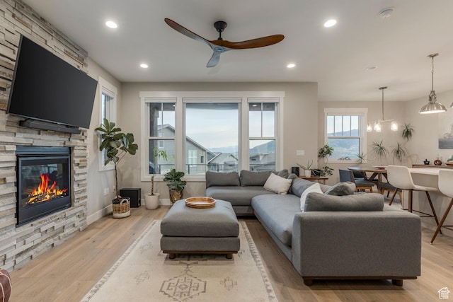 11721 N Shoreline Dr, Hideout, UT 84036 - living room featuring a ceiling fan, light wood finished floors, a fireplace, and recessed lighting