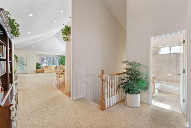 1369 E Farm Dr, Murray, UT 84117 - hallway with carpet floors, an upstairs landing, recessed lighting, high vaulted ceiling, and tile patterned flooring