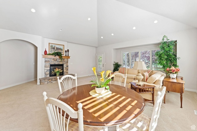 1369 E Farm Dr, Murray, UT 84117 - dining room with light colored carpet, a stone fireplace, recessed lighting, and high vaulted ceiling