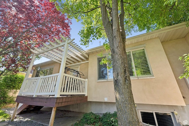 1369 E Farm Dr, Murray, UT 84117 - view of home's exterior with a deck, stucco siding, and a pergola