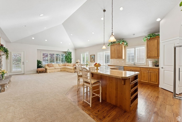 1369 E Farm Dr, Murray, UT 84117 - kitchen featuring stainless steel dishwasher, a kitchen breakfast bar, a center island, pendant lighting, and open floor plan