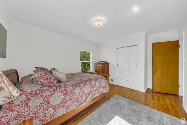 1912 E Ramona Ave, Salt Lake City, UT 84108 - bedroom featuring crown molding, wood finished floors, and a closet