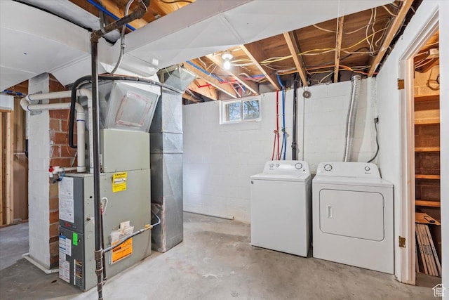 535 W Fern Dr, Midvale, UT 84047 - basement featuring separate washer and dryer, heating unit, and concrete block wall