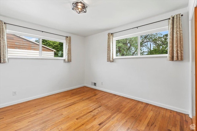 535 W Fern Dr, Midvale, UT 84047 - empty room featuring healthy amount of natural light and light wood-type flooring