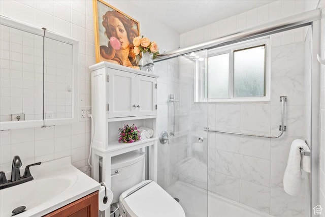535 W Fern Dr, Midvale, UT 84047 - bathroom featuring a shower stall, vanity, tasteful backsplash, and tile walls