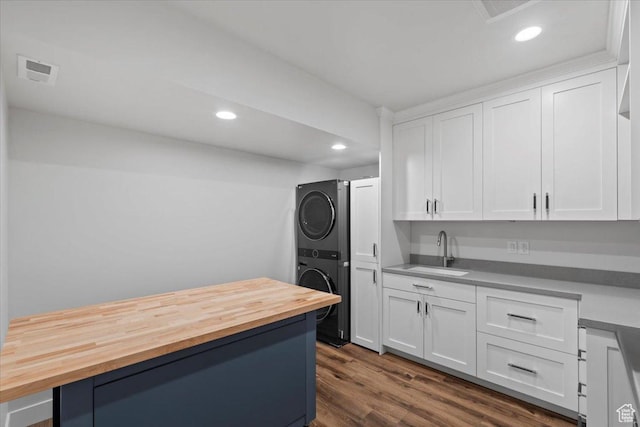 6221 W Applecross Cir, Highland, UT 84003 - kitchen featuring stacked washer / dryer, butcher block counters, white cabinets, recessed lighting, and dark wood finished floors