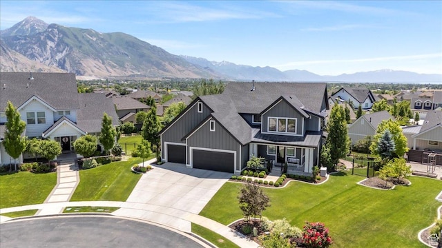 6221 W Applecross Cir, Highland, UT 84003 - view of front facade with board and batten siding, a residential view, driveway, and a mountain view