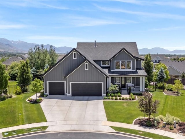 6221 W Applecross Cir, Highland, UT 84003 - craftsman-style house with a porch, board and batten siding, a mountain view, concrete driveway, and an attached garage