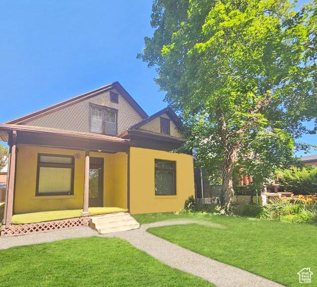 237 S 800 E, Salt Lake City, UT 84102 - view of front of house with a front lawn and stucco siding