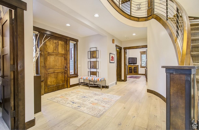 4896 Last Stand Dr, Snyderville, UT 84098 - foyer with recessed lighting, light wood-style floors, and stairs