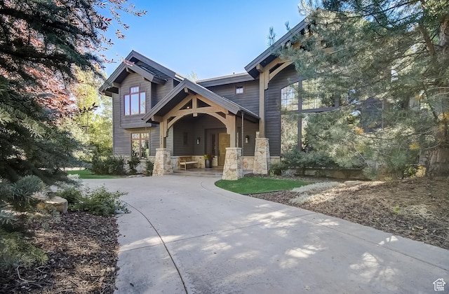4896 Last Stand Dr, Snyderville, UT 84098 - craftsman-style home featuring a porch and stone siding