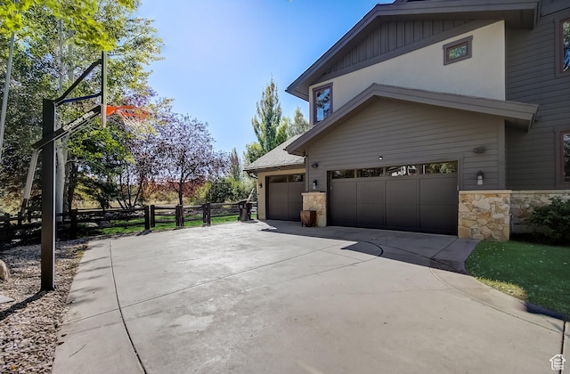 4896 Last Stand Dr, Snyderville, UT 84098 - view of property exterior with stone siding and concrete driveway