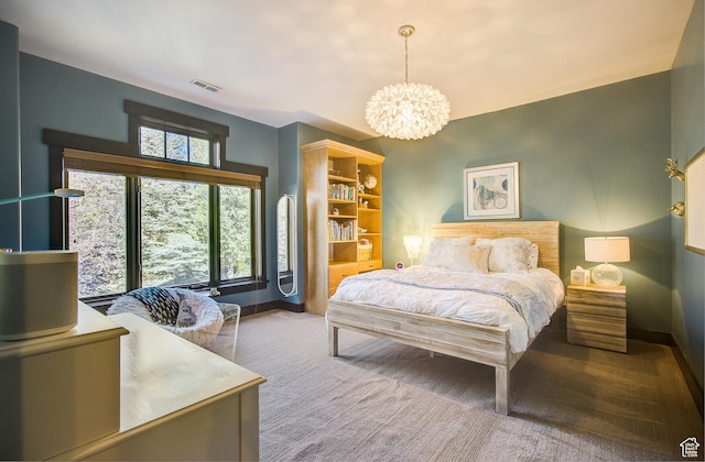 4896 Last Stand Dr, Snyderville, UT 84098 - carpeted bedroom featuring a chandelier and baseboards