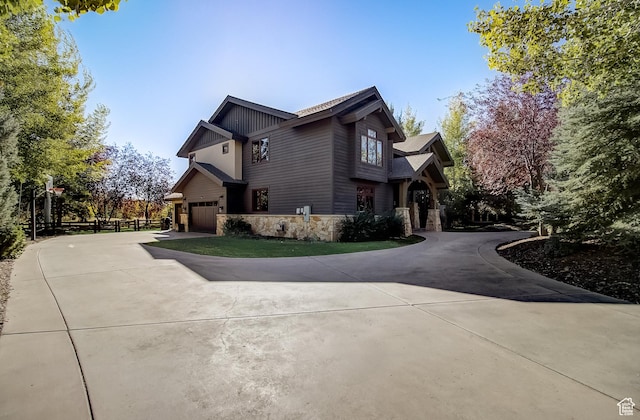 4896 Last Stand Dr, Snyderville, UT 84098 - view of side of property featuring stone siding and curved driveway