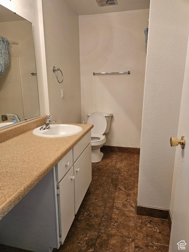 4619 S Quail Vista Ln E Unit J, Salt Lake City, UT 84117 - full bathroom with toilet and vanity