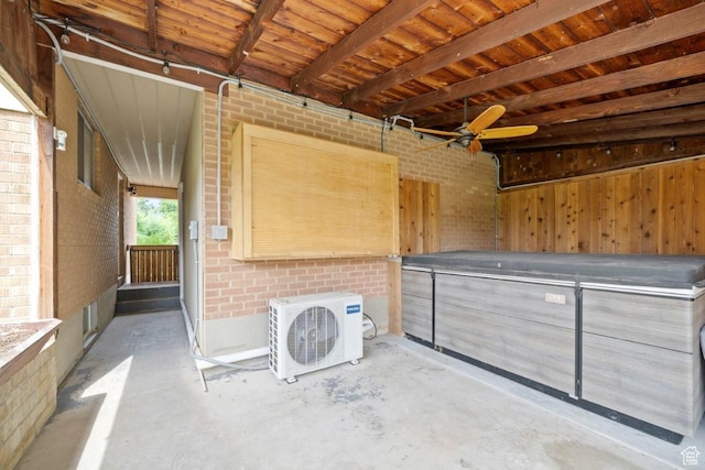 1856 N Alder St, Layton, UT 84041 - misc room with unfinished concrete floors, brick wall, and ceiling fan