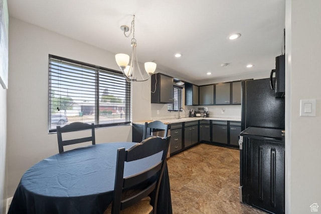 1856 N Alder St, Layton, UT 84041 - kitchen with black appliances, light countertops, recessed lighting, pendant lighting, and a chandelier