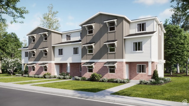 212 N Loring Ave W Unit 115, Santaquin, UT 84655 - multi unit property featuring board and batten siding, brick siding, and a front lawn