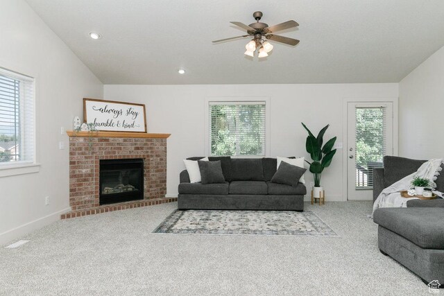 287 S 375 W, Providence, UT 84332 - carpeted living room featuring healthy amount of natural light, a ceiling fan, a fireplace, and recessed lighting