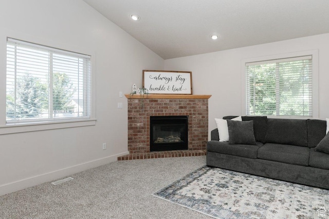287 S 375 W, Providence, UT 84332 - living room featuring plenty of natural light, carpet floors, a fireplace, vaulted ceiling, and recessed lighting