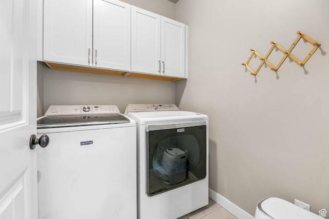 8271 S Allison Bend Dr S, West Jordan, UT 84081 - laundry area featuring washer and dryer, cabinet space, and light tile patterned floors