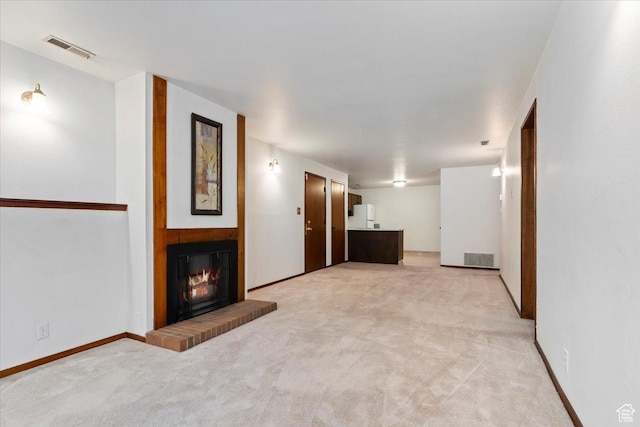4153 S 2700 W Unit 1G, Taylorsville, UT 84129 - unfurnished living room with light carpet and a glass covered fireplace