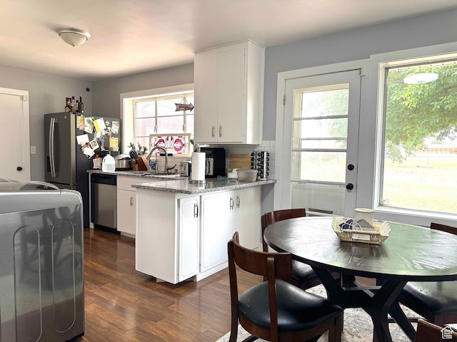 615 E Ben Lomond Ave, South Ogden, UT 84403 - kitchen featuring stainless steel dishwasher, white cabinetry, a peninsula, stove, and dark wood-style floors