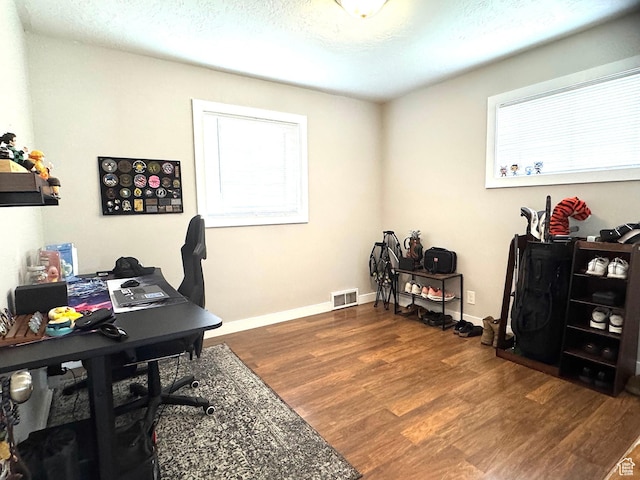 615 E Ben Lomond Ave, South Ogden, UT 84403 - office area with wood finished floors, plenty of natural light, and a textured ceiling
