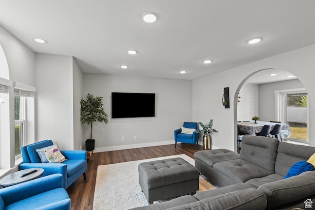 332 E 2475 N, North Logan, UT 84341 - living room with arched walkways, wood finished floors, and recessed lighting