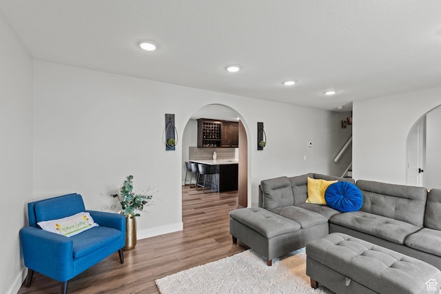 332 E 2475 N, North Logan, UT 84341 - living room with arched walkways, stairway, wood finished floors, and recessed lighting