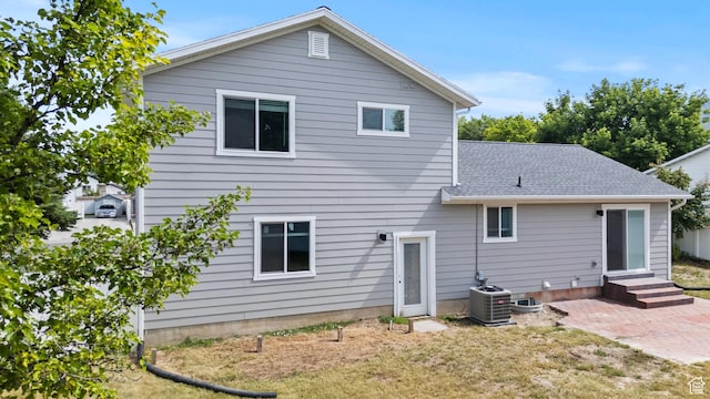 332 E 2475 N, North Logan, UT 84341 - back of house with entry steps, a patio area, a shingled roof, and a yard