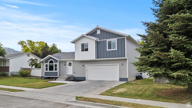 332 E 2475 N, North Logan, UT 84341 - view of front of property featuring board and batten siding, concrete driveway, and a garage