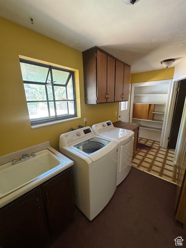2650 E Willow Wick Dr, Sandy, UT 84093 - laundry area with cabinet space, washing machine and clothes dryer, tile patterned floors, and a textured ceiling