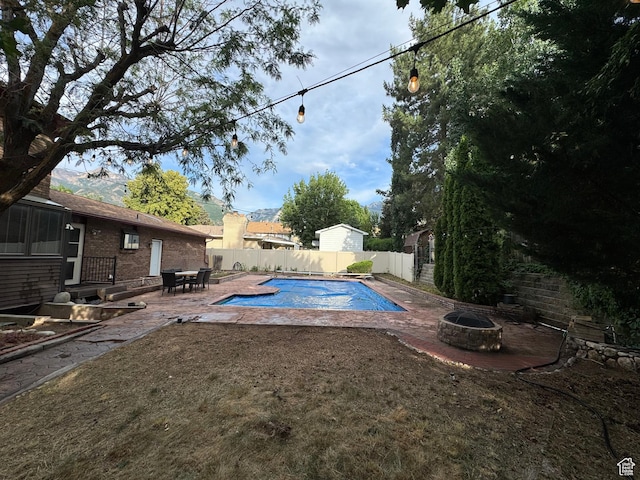 2650 E Willow Wick Dr, Sandy, UT 84093 - view of swimming pool featuring an outdoor fire pit, a fenced backyard, and a patio area