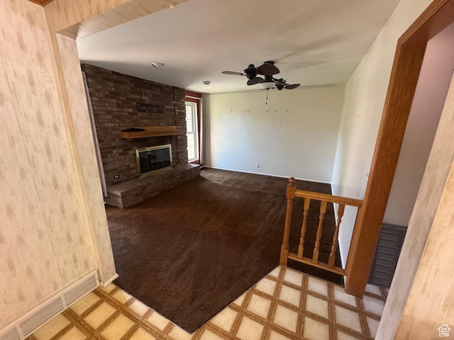 2650 E Willow Wick Dr, Sandy, UT 84093 - unfurnished living room featuring tile patterned floors, ceiling fan, and a brick fireplace