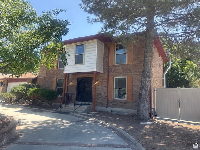 2650 E Willow Wick Dr, Sandy, UT 84093 - view of front of home with brick siding and a gate