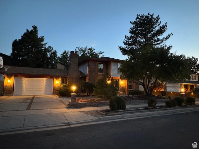 2650 E Willow Wick Dr, Sandy, UT 84093 - traditional-style house featuring driveway, a garage, and a chimney
