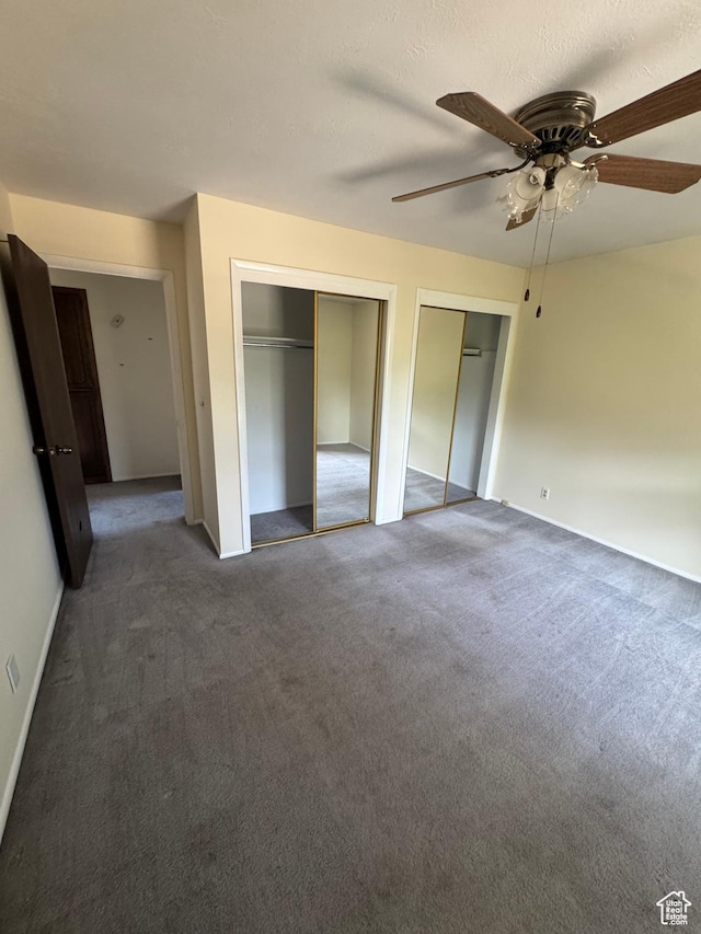 2650 E Willow Wick Dr, Sandy, UT 84093 - unfurnished bedroom with two closets, carpet flooring, and a ceiling fan