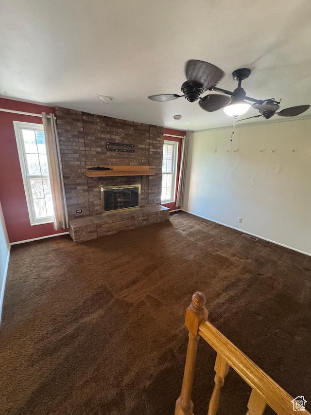 2650 E Willow Wick Dr, Sandy, UT 84093 - unfurnished living room with plenty of natural light, carpet, and a brick fireplace