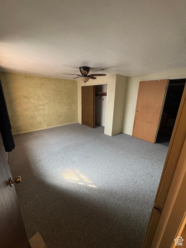 2650 E Willow Wick Dr, Sandy, UT 84093 - unfurnished bedroom with carpet floors, a textured ceiling, and ceiling fan