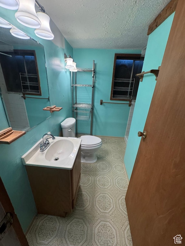 2650 E Willow Wick Dr, Sandy, UT 84093 - bathroom with a textured ceiling and vanity