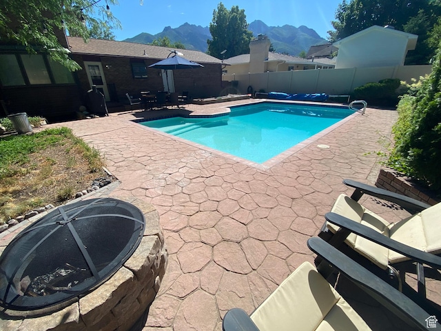2650 E Willow Wick Dr, Sandy, UT 84093 - view of swimming pool with a patio area, a mountain view, and a fenced backyard