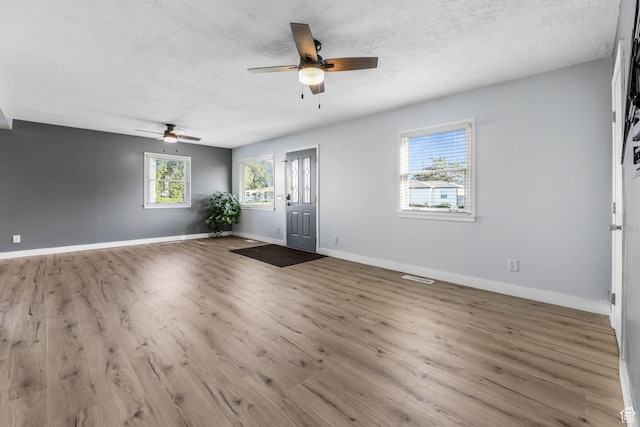 4281 W 5780 S, Salt Lake City, UT 84118 - entrance foyer with a ceiling fan, wood finished floors, and a textured ceiling