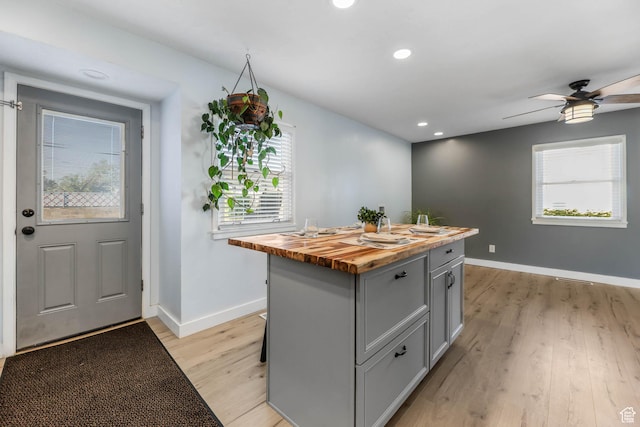 4281 W 5780 S, Salt Lake City, UT 84118 - kitchen featuring wooden counters, gray cabinetry, a center island, light wood finished floors, and plenty of natural light