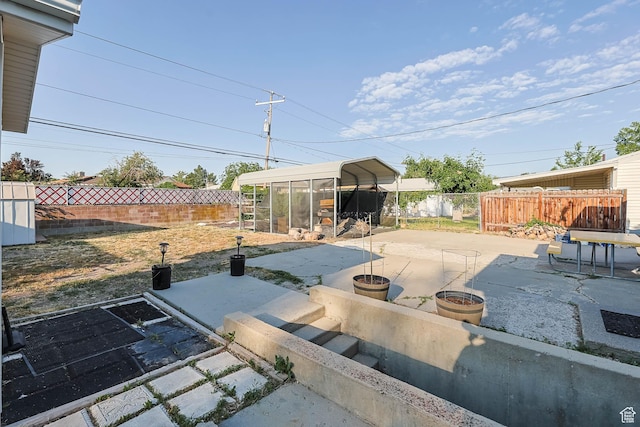 4281 W 5780 S, Salt Lake City, UT 84118 - fenced backyard with a patio area and a carport